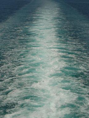 Long trail of sea foam left by the ferry to Pireaus