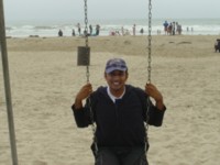 Spencer on the swings on a beach near San Luis Obispo
