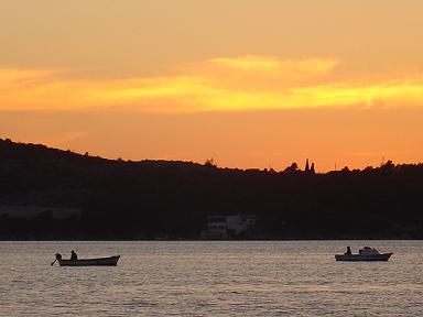 Sailboats in teh sunset in Sibenik